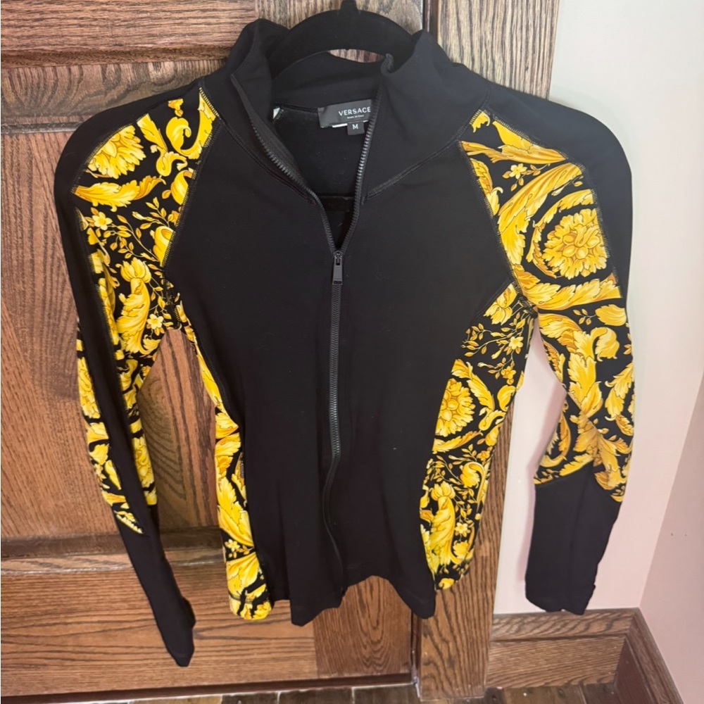 Versace Women's Black and Gold athleisure set.